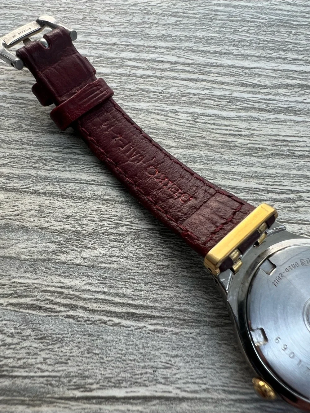 Seiko SQ 50 Silver and Gold Case Watch with White Dial and Leather Strap